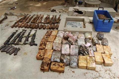 Ammunition and explosives seized from suspected members of Hezbollah are displayed after a raid of a building in Nigeria's northern city of Kano