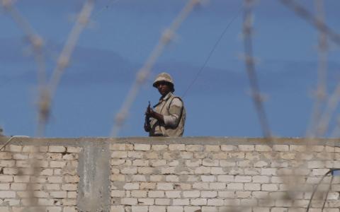 An Egyptian soldier guards the border between Egypt and southern Gaza Strip
