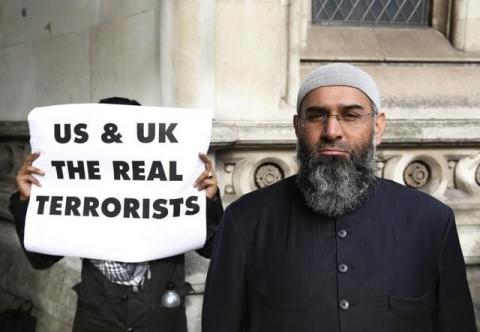 Demonstrator Anjem Choudary, protests in support of Islamist cleric Abu Hamza al-Masri, who is appealing against his extradition to the U.S., outside the High Court in London, October 5, 2012. PHOTO BY REUTERS/Luke MacGregor