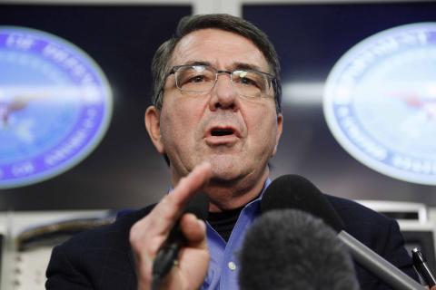 U.S. Secretary of Defense Ash Carter speaks during his first news conference since his swearing-in, aboard his plane en route to Afghanistan, February 20, 2015. PHOTO BY REUTERS/Jonathan Ernst