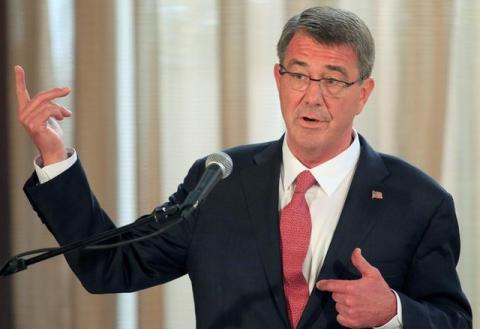 Visiting U.S. Defense Secretary Ash Carter gestures during a joint press conference with his Filipino counterpart Voltaire Gazmin (not pictured) at the presidential palace in Manila, April 14, 2016. PHOTO BY REUTERS/Romeo Ranoco