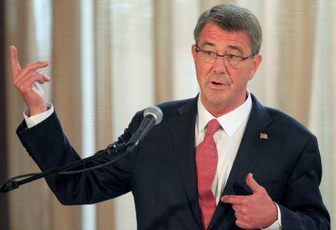 Visiting U.S. Defense Secretary Ash Carter gestures during a joint press conference with his Filipino counterpart Voltaire Gazmin (not pictured) at the presidential palace in Manila, April 14, 2016. PHOTO BY REUTERS/Romeo Ranoco