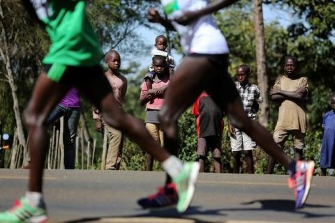 Athletes run on a road during a half marathon near the town of Eldoret in western Kenya, March 20, 2016. PHOTO BY REUTERS/Siegfried Modola