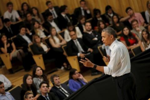 President Obama listen a question from the audience during a town hall meeting with entrepreneurs as part of Obama's two-day visit to Argentina, in Buenos Aires. PHOTO BY REUTERS/Carlos Barria