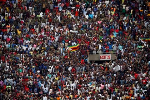 Crowds cheer at Emmerson Mnangagwa's presidential inauguration in Harare, Zimbabwe, November 24, 2017. PHOTO BY REUTERS/Siphiwe Sibeko