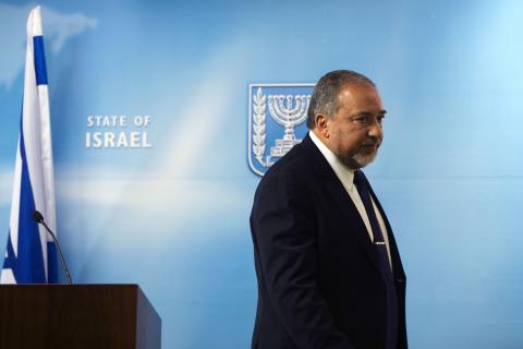 Israel's Foreign Minister Avigdor Lieberman leaves after giving a statement to the media at his Jerusalem office, December 2, 2014. PHOTO BY REUTERS/ Ronen Zvulun