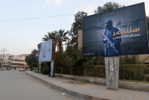 Islamic State billboards are seen along a street in Raqqa, eastern Syria, which is controlled by the Islamic State, October 29, 2014. PHOTO BY REUTERS/Nour Foura