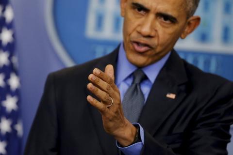 U.S. President Barack Obama gestures as he holds his end of the year news conference at the White House in Washington, December 18, 2015. PHOTO BY REUTERS/Carlos Barria