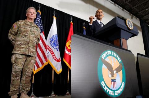 General Raymond Thomas (L) stands by as U.S. President Barack Obama speaks to active service members and their families during his visit to MacDill Air Force Base, home to U.S. Central Command and U.S. Special Operations Command, in Tampa, Florida, U.S., December 6, 2016. PHOTO BY REUTERS/Kevin Lamarque