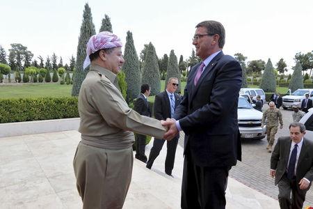 Iraq's Kurdistan region's President Massoud Barzani (L) shakes hands with U.S. Defense Secretary Ash Carter in Erbil, Iraq, July 24, 2015. PHOTO BY REUTERS/Azad Lashkari