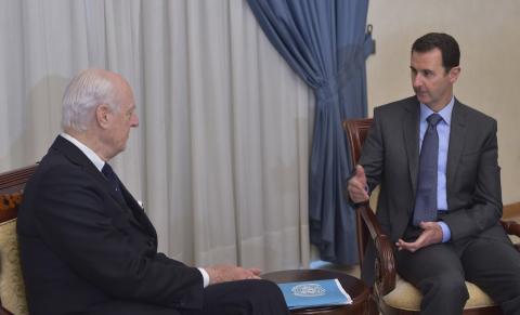 Syria's President Bashar al-Assad (R) meets United Nations Syria mediator Staffan de Mistura, in Damascus February 11, 2015, in this picture released by Syria's national news agency SANA. photo by REUTERS/SANA/Handout via Reuters