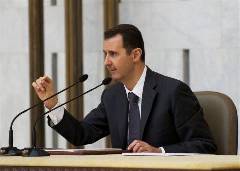 Syria's President Bashar al-Assad heads the plenary meeting of the central committee of the ruling al-Baath party, in Damascus in this handout photograph distributed by Syria's national news agency SANA