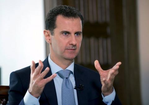 Syria's President Bashar al-Assad speaks during an interview with Russia's RIA new agency, in Damascus, Syria, March 30, 2016. PHOTO BY REUTERS/SANA