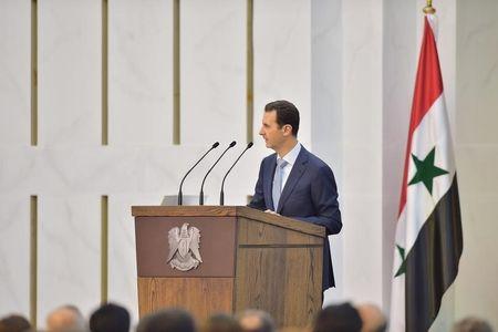 Syria's president Bashar al-Assad speaks during his meeting with the heads and members of public organizations and professional associations in Damascus, Syria, in this handout released by Syria's national news agency SANA, July 26, 2015. PHOTO BY REUTERS/SANA