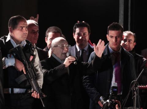 Beji Caid Essebsi (C), Nidaa Tounes party leader, gestures outside the party headquarters in Tunis, December 21, 2014. PHOTO BY REUTERS/Zoubeir Souissi