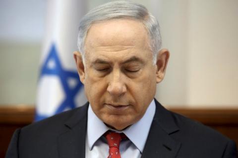 Israeli Prime Minister Benjamin Netanyahu closes his eyes during the weekly cabinet meeting in Jerusalem, April 10, 2016. PHOTO BY REUTERS/Gali Tibbon