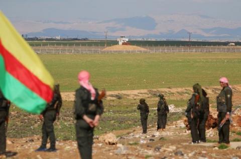 Kurdish members of the Self-Defense Forces stand near the Syrian-Turkish border in the Syrian city of al-Derbasiyah during a protest against the operations launched in Turkey by government security forces against the Kurds, February 9, 2016. PHOTO BY REUTERS/Rodi Said