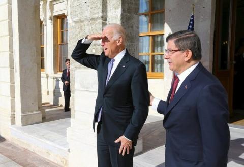 U.S. Vice President Joe Biden (L) chats with Turkish Prime Minister Ahmet Davutoglu before their meeting in Istanbul, Turkey January 23, 2016. PHOTO BY REUTERS/Hakan Goktepe