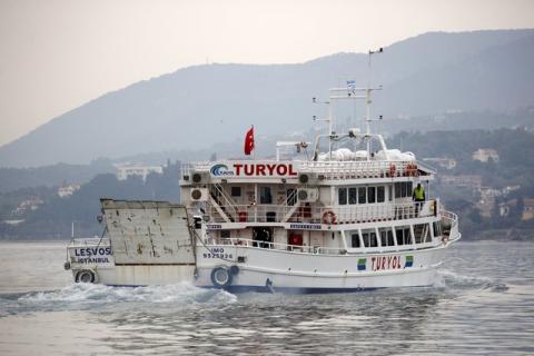 A Turkish-flagged passenger boat carrying migrants to be returned to Turkey leaves the port of Mytilene on the Greek island of Lesbos, April 8, 2016. PHOTO BY REUTERS/Giorgos Moutafis