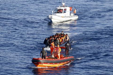 A Turkish Coast Guard fast rigid-hulled inflatable boat tows a dinghy filled with refugees and migrants in the Turkish territorial waters of the North Aegean Sea, following a failed attempt at crossing to the Greek island of Chios, off the shores of Izmir, Turkey, February 28, 2016. PHOTO BY TURKEY REUTERS/Umit Bektas