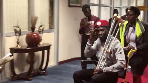 Bobi Wine is seen in a wheelchair just before his departure at Entebbe International Airport, in Entebbe, Uganda, August 31, 2018 in this still image taken from a social media video on September 1, 2018. PHOTO BY REUTERS/Nicholas Opiyo