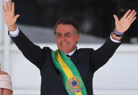 Brazil's new President Jair Bolsonaro gestures after receiving the presidential sash from outgoing President Michel Temer at the Planalto Palace, in Brasilia, Brazil, January 1, 2019. PHOTO BY REUTERS/Sergio Moraes