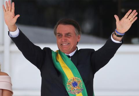 Brazil's new President Jair Bolsonaro gestures after receiving the presidential sash from outgoing President Michel Temer at the Planalto Palace, in Brasilia, Brazil, January 1, 2019. PHOTO BY REUTERS/Sergio Moraes