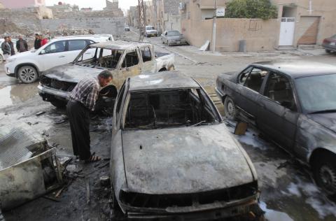 A man looks at damages at the site of a bomb attack in Kirkuk, December 5, 2014. PHOTO BY REUTERS/Ako Rasheed