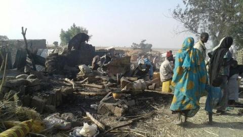 People walk at the site after a bombing attack of an internally displaced persons camp in Rann, Nigeria, January 17, 2017. PHOTO BY REUTERS/MSF
