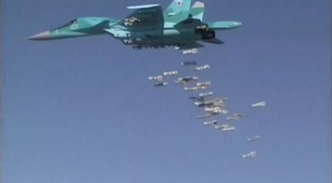 A still image, taken from video footage and released by Russia's Defence Ministry on August 18, 2016, shows a Russian Sukhoi Su-34 fighter-bomber based at Iran's Hamadan air base dropping off bombs in the Syrian province of Deir ez-Zor. PHOTO BY REUTERS/Ministry of Defence of the Russian Federation