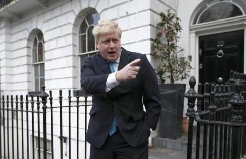 London Mayor Boris Johnson prepares to speak to the media in front of his home in London, Britain, February 21, 2016. PHOTO BY REUTERS/Peter Nicholls