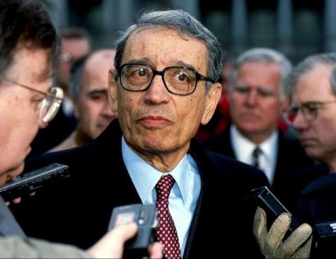 U.N. Secretary-General Boutros Boutros-Ghali is surrounded by members of the media as he leaves the White House after meeting U.S. President Bill Clinton, in this February 23, 1993 file picture. PHOTO BY REUTERS/Stringer