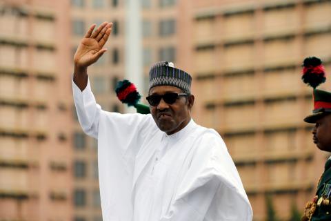 Nigerian President Muhammadu Buhari waves at the crowd while he drives around the venue during his inauguration for a second term in Abuja, Nigeria, May 29, 2019. PHOTO BY REUTERS/Afolabi Sotunde