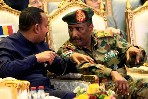Sudan's Head of Transitional Military Council, Lieutenant General Abdel Fattah Al-Burhan, talks to Ethiopia's Prime Minister Abiy Ahmed during the signing of the power sharing deal, that paves the way for a transitional government, and eventual elections, following the overthrow of long-time leader Omar al-Bashir, in Khartoum, Sudan, August 17, 2019. PHOTO BY REUTERS/Mohamed Nureldin Abdallah