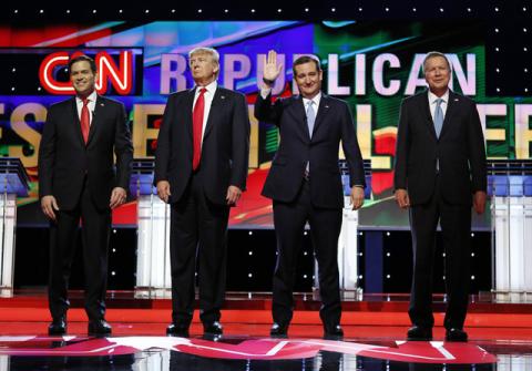 Marco Rubio, Donald Trump, Ted Cruz and John Kasich stand together onstage at the start of the Republican candidates debate sponsored by CNN at the University of Miami in Miami, Florida, March 10, 2016. PHOTO BY REUTERS/Joe Skipper