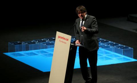 Catalan regional President Carles Puigdemont speaks next to ballot boxes during a meeting about the terms and conditions of a proposed independence referendum in Barcelona, Spain, July 4, 2017. PHOTO BY REUTERS/Albert Gea
