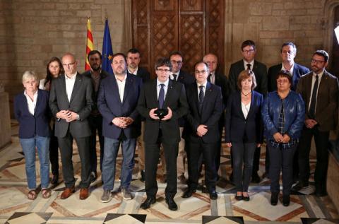 Catalan Regional President Carles Puigdemont (C) is flanked by members of his government as he makes an statement at Generalitat Palace in Barcelona, Spain, October 1, 2017. PHOTO BY REUTERS/Catalan Goverment/Jordi Bedmar Pascual