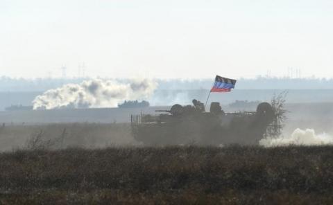 An armored carrier, imitating an enemy vehicle, drives during military exercises conducted by Ukrainian armed forces at the Shiroky Lan training ground in Mykolaiv region, Ukraine, in this October 30, 2015 file photo. PHOTO BY REUTERS/Oleksandr Klymenko