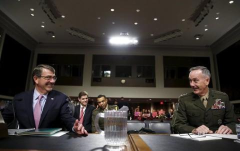 United States Secretary of Defense Ash Carter (L) and Joint Chiefs of Staff Chairman USMC General Joseph Dunford, Jr. (R) chat before testifying at a Senate Armed Forces Committee hearing on "United States Strategy in the Middle East" in Washington, October 27, 2015. PHOTO BY REUTERS/Gary Cameron