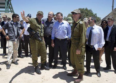 U.S. Secretary of Defense Ash Carter (front 3rd L), Israel's Defence Minister Moshe Ya'alon (front 2nd L), Israeli Brigadier General Moni Katz (front L) and Deputy Chief of Staff Major General Yair Golan stand at the Hussein Lookout near Kiryat Shmona, Israel's border with Lebanon, July 20, 2015. PHOTO BY REUTERS/Carolyn Kaster