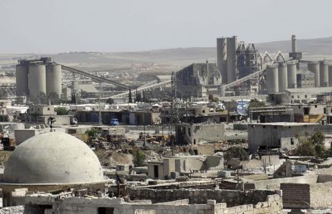 A general view shows a cement factory that activists said is controlled by forces loyal to Syria's president Bashar Al-Assad in Ramouse