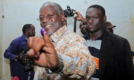 Tanzanian presidential candidate of the ruling Chama Cha Mapinduzi (CCM) party John Pombe Magufuli shows his inked finger after casting his vote during the presidential and parliamentary election at his hometown Chato district, in Geita region, October 25, 2015. PHOTO BY REUTERS/Stringer
