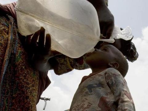 A child drinks water at Kibati camp near the city of Goma in the eastern Democratic Republic of Congo. PHOTO BY REUTERS/Peter Andrews