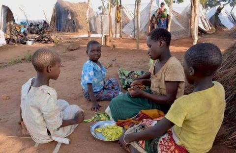 Mozambican child refugees prepare food at Kapise camp in Malawi's Mwanza district, January 18, 2016. PHOTO BY REUTERS/Eldson Chagara