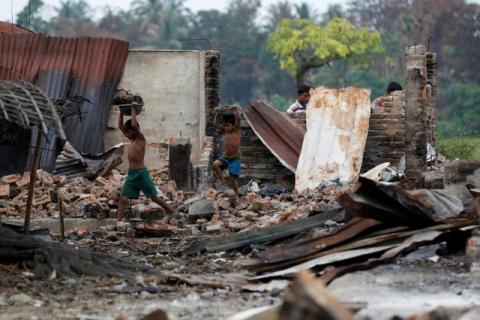 Children recycle goods from the ruins of a market which was set on fire at a Rohingya village outside Maugndaw in Rakhine state, Myanmar, October 27, 2016. PHOTO BY REUTERS/Soe Zeya Tun