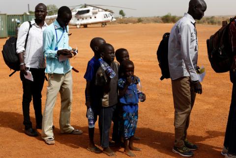 Machiey Mario, 8, Ruai Mario, 10, Nyameer Mario, 6 and Nyawan Mario, 4 (L-R), wait to board a United Nations flight to Juba where they will be reunited with their mother, near Bentiu, South Sudan, February 13, 2017. PHOTO BY REUTERS/Siegfried Modola