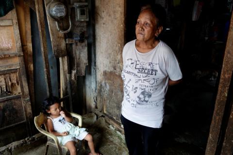 Clarita Alia, 62, stands at her home while talking about her four sons which have died in execution-style killings in Davao, Philippines, May 14, 2016. PHOTO BY REUTERS/Andrew RC Marshall