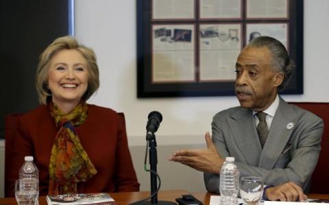 Democratic U.S. presidential candidate Hillary Clinton (L) sits with The Reverend Al Sharpton, Founder and President of the National Action Network, as she meets with civil rights leaders at the National Urban League in the Manhattan borough of New York City, February 16, 2016. PHOTO BY REUTERS/Mike Segar
