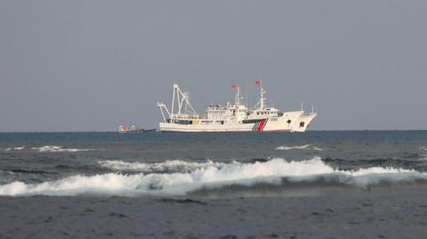 China Coast Guard vessels are pictured at the disputed Scarborough Shoal, April 5, 2017. PHOTO BY REUTERS/Erik De Castro