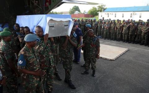 Tanzanian soldiers receive the bodies of their peacekeepers killed while serving in the United Nations Organization Stabilization Mission in the Democratic Republic of the Congo (MONUSCO) during an attack in their base in Beni territory, at the airport in Dar es Salaam, Tanzania, December 11, 2017. PHOTO BY REUTERS/Emmanuel Herman